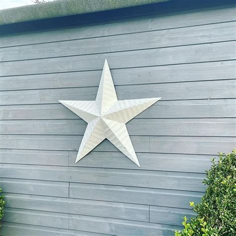 why do people put metal stars on their houses|stars on barns meaning.